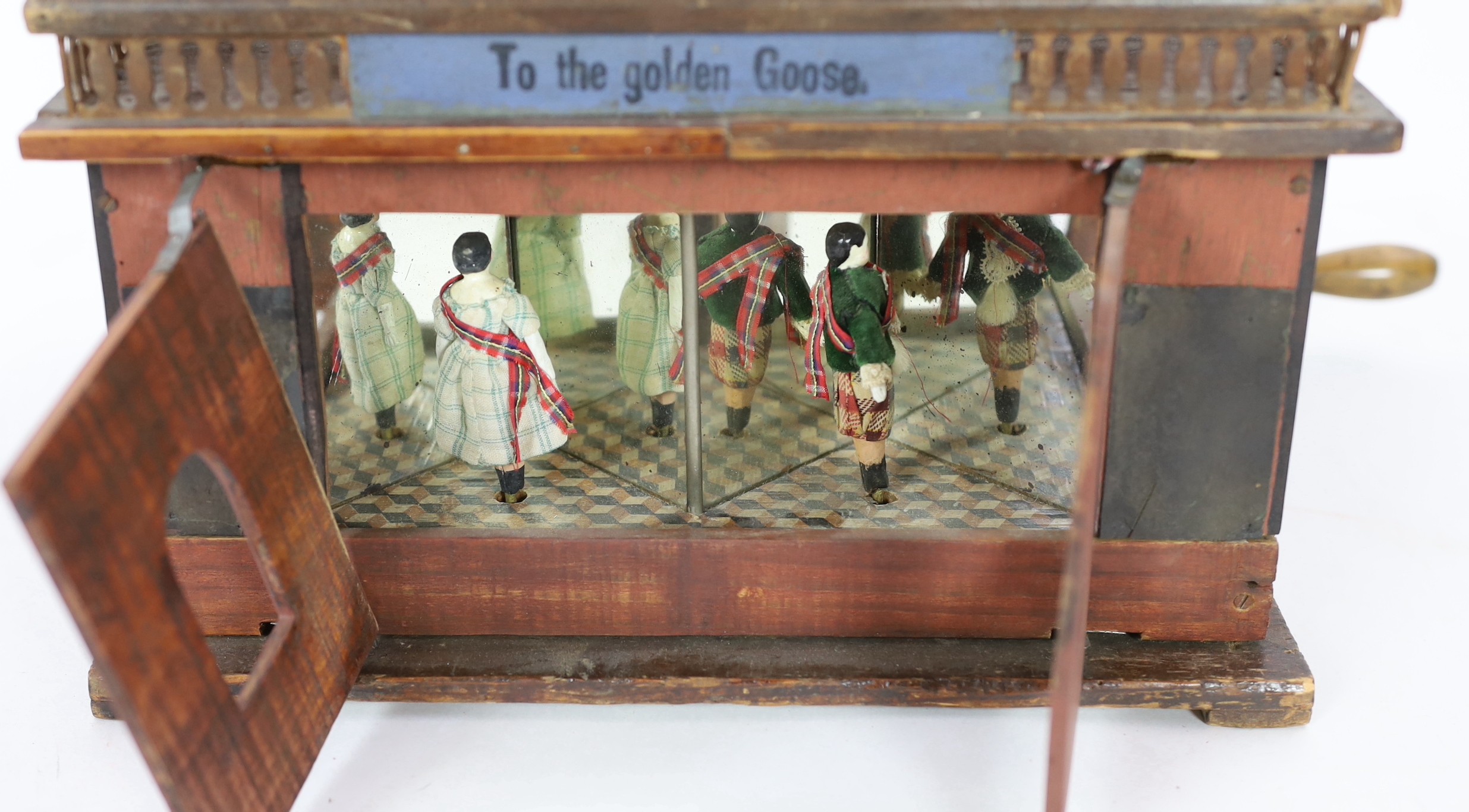 ‘To The Golden Goose’: A rare German musical toy modelled as two storey half-timbered building, circa 1890, 39cm high